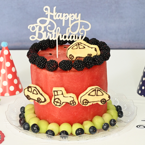 Whimsical Wheels Watermelon Cake